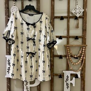 BloomChic Cream Blouse with Black Bow Print